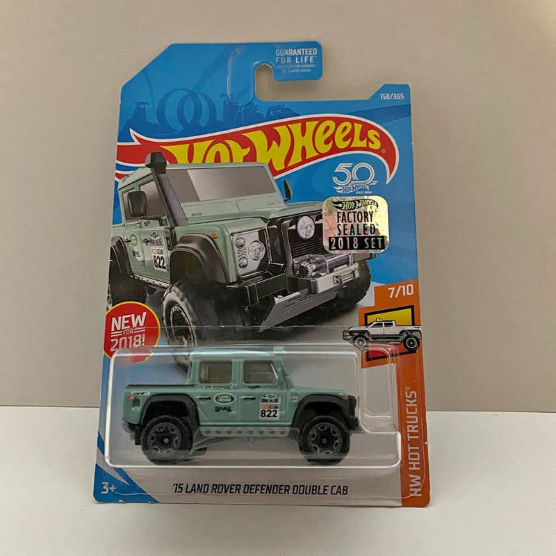 Green Land Rover Defender double cab die-cast truck in Hot Wheels blister pack