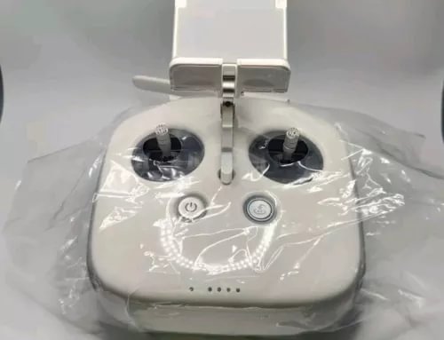 White drone remote controller with dual joysticks and power button