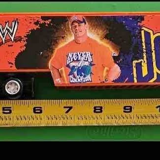Diecast semi truck toy with WWE wrestler graphic and colorful side panels