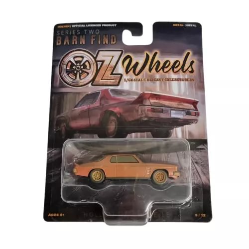 1:64 scale diecast coupe model in blister pack, orange with gold wheels