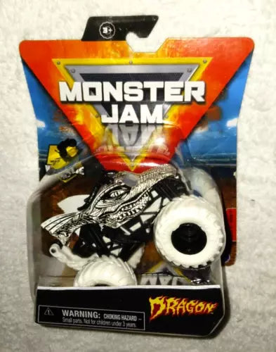 Die-cast monster truck toy with white tires and black body, Dragon-themed packaging card