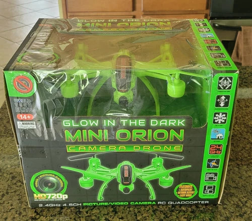 Glow-in-the-dark mini Orion camera drone RC quadcopter in green retail box