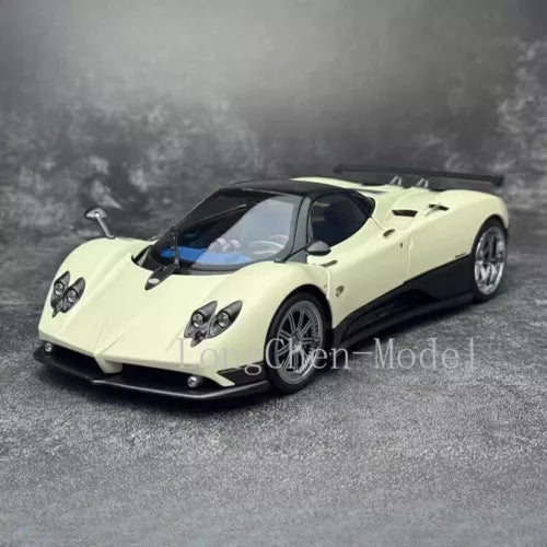 Light yellow diecast sports car model with black hood and front 3/4 view, 1:18 scale