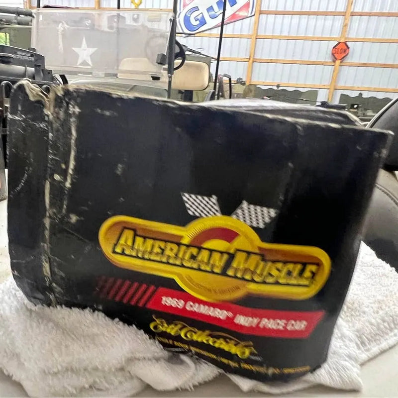 Black diecast car box with American Muscle yellow logo