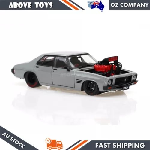 Cool grey 1:24 diecast street custom car with red engine detail, front three-quarter view