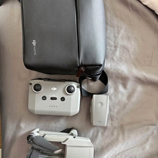 Drone with controller, battery, and zippered carrying case