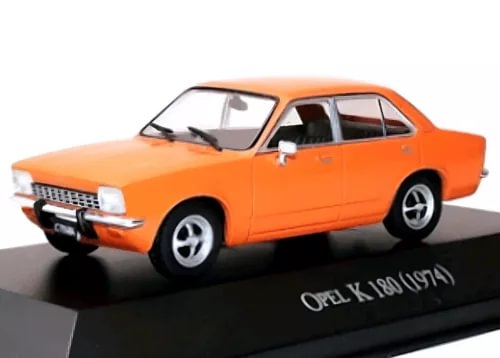 Orange 1974 Opel K Kadett sedan diecast model, front three-quarter view on display base.