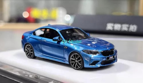 Blue BMW M2 Competition diecast coupe model car with front 3/4 view