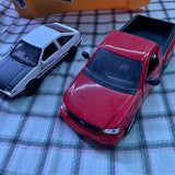 Diecast toy cars lot with red and light gray vehicles