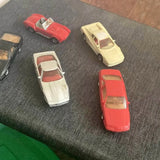 Vintage diecast model cars, red and white vehicle set