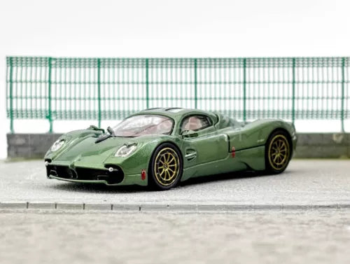 1:64 scale green sports diecast model car, front three-quarter view, black wheels