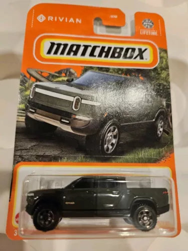 Matchbox diecast pickup truck in clear blister, dark green body, wheels visible