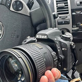 Nikon D750 DSLR camera with attached lens and side controls
