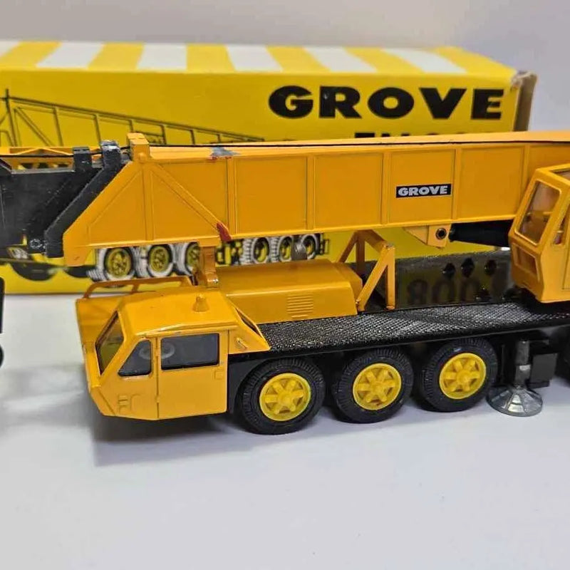 Vintage diecast crane model TM800 with yellow Grove boom and cab, front view