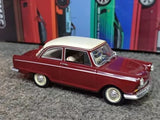 Maroon classic diecast car with white roof and chrome details