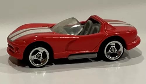 Red convertible diecast car with white racing stripes and chrome wheels