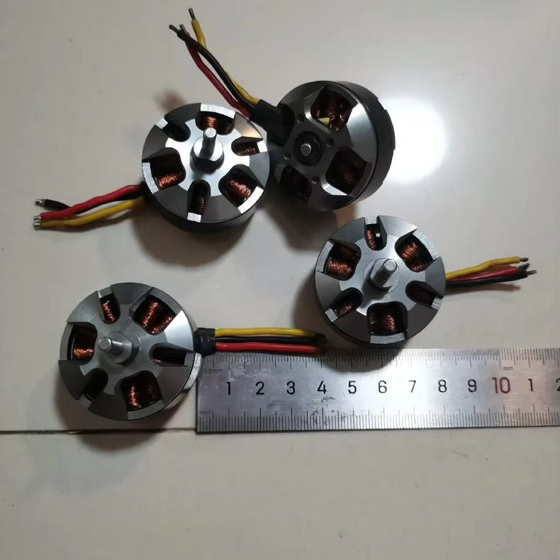 Micro brushless DC drone motor, silver housing with prop shaft and red/black wires, size shown