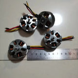 Micro brushless DC drone motor, silver housing with prop shaft and red/black wires, size shown