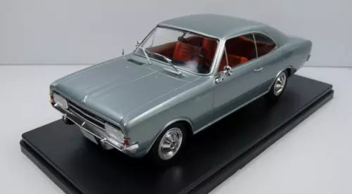 Light blue 1:24 diecast model car with open hood detail on display base