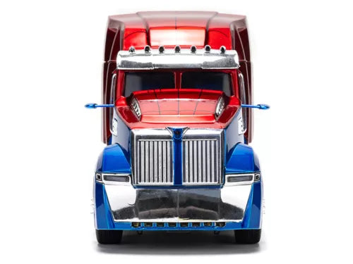 Diecast truck tractor front in blue and red with chrome grille and bumper.