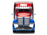 Diecast truck tractor front in blue and red with chrome grille and bumper.