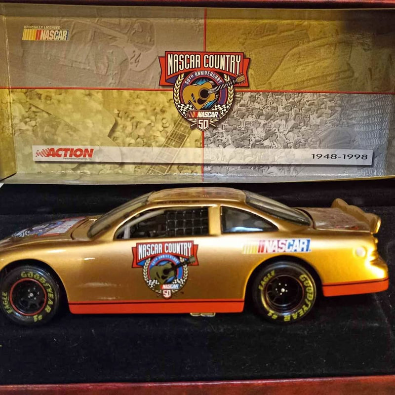 Gold Nascar Goodyear diecast race car with NASCAR Country and number 5D decals