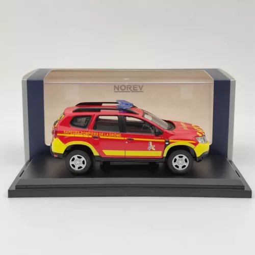 Fire rescue diecast SUV model with red, yellow, and blue livery in display case