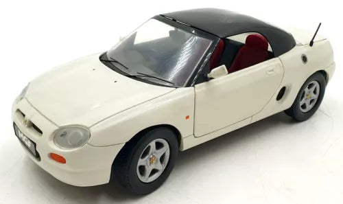 White diecast model car with open-top cockpit, front three-quarter view