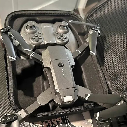 Gray quadcopter drone with fold-out arms and central camera mount