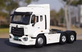 White HOWO-NX tractor truck diecast model with chrome grille and sleeper cab
