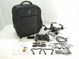 RC quadcopter drone with controller, spare parts, cables, and black carrying case