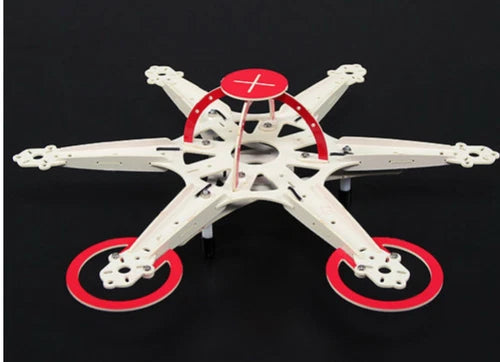 Micro-hex drone frame with white arms and red circular PCB mounts