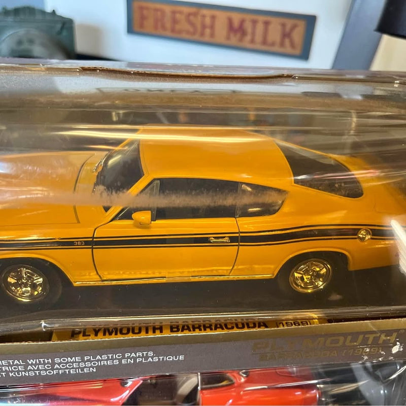 Vintage yellow diecast muscle car with black stripe, side view in clear display box