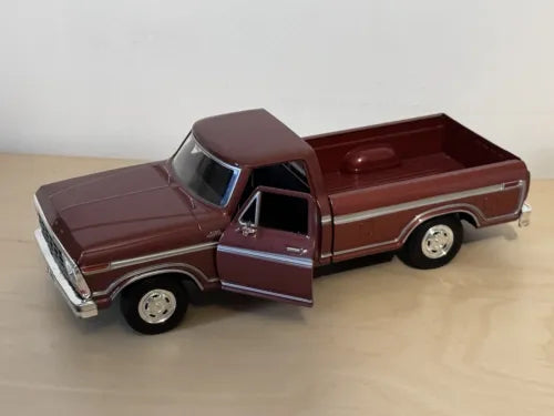 Brown 1979 Ford F-150 diecast pickup truck, front side view