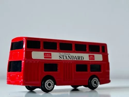 Red London double-decker bus model diecast with side 'STANDARD' lettering