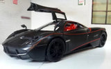 Black 2012 diecast model car with red interior, detailed wheels and front splitter.