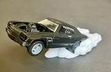 1/64 diecast muscle car display statue, dark grey, front wheel up with white smoke