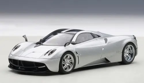 Metallic silver diecast sports car model, front 3/4 view, black grille