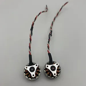 Compact drone power motors with red-and-black striped wires and circular metal housings