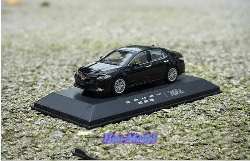 Diecast alloy model car, black sedan on black display base
