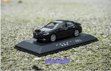 Diecast alloy model car, black sedan on black display base