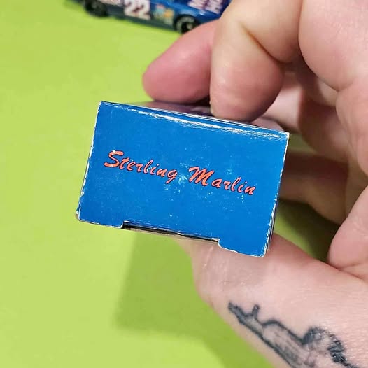 Blue diecast box with red text Sterling Matlin
