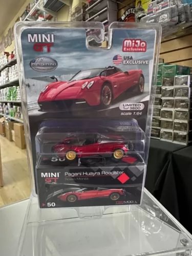 1/64 red Pagani Huayra Roadster diecast car in blister packaging
