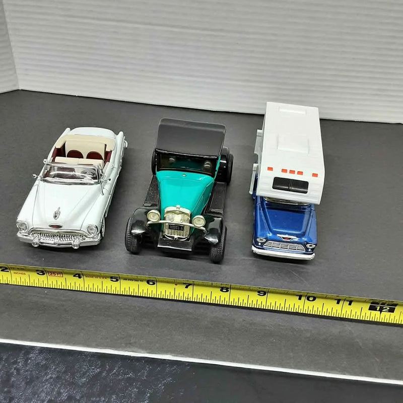Diecast car set of three vintage models, white, turquoise, and blue cars