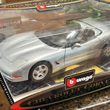 Silver Corvette convertible diecast car model, front three-quarter view, open top.