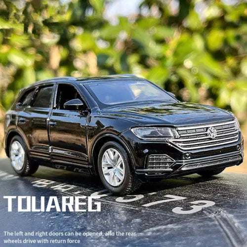 1:36 scale Volkswagen Touareg diecast SUV model car in dark blue, front 3/4 view