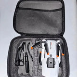 Drone kit in open zippered case, white and orange drone with propellers