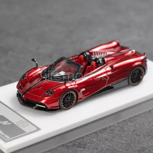 1:64 scale red convertible diecast model car, black wheels, front 3/4 view