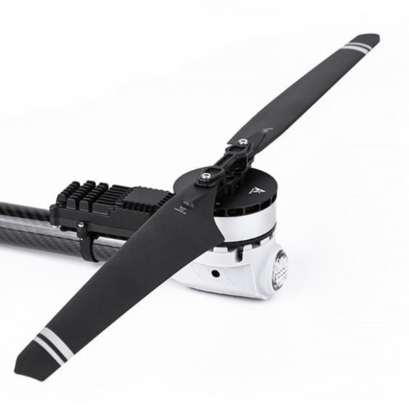 Quadcopter drone with black and white propeller and motor mount