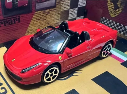 Bburago 1:64 red Ferrari 458 Spider diecast model car, open-top, front three-quarter view